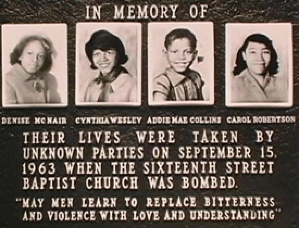 A memorial plaque with the photos of 4 girls killed in the bombing of the Sixteenth Street Baptist Church in 1963.
