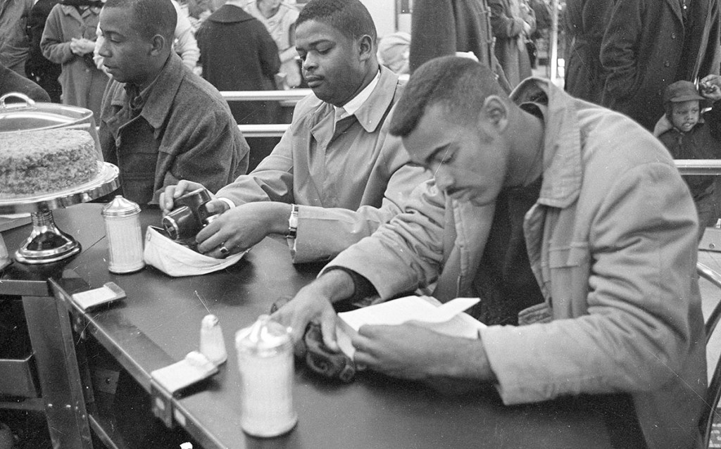 Black protestors quietly sitting in at a Woolworth's lunch counter in Durham, NC.
