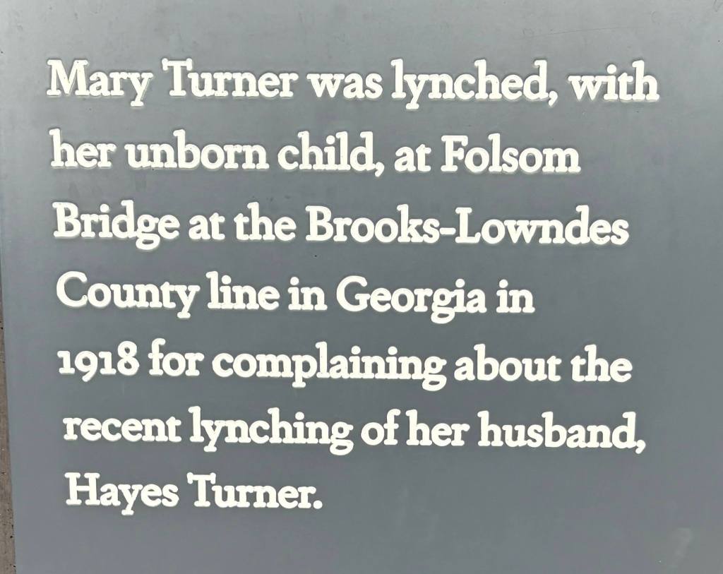 Sign explaining Mary Turner and her unborn child were lynched for complaining about the lynching of her husband.